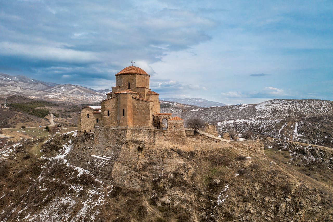 Jvari Monastery, a historic Georgian site in winter landscape.